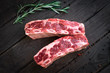 raw beef ribs kalbi on wooden background, top view