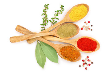 mix of spices in wooden spoon isolated on a white background. Top view. Flat lay. Set or collection