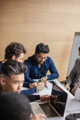 Canvas Print - Close up of multiracial colleagues chat talking or discussing something in office, black man speak with female coworker negotiating about business project, having conversation. Cooperation concept