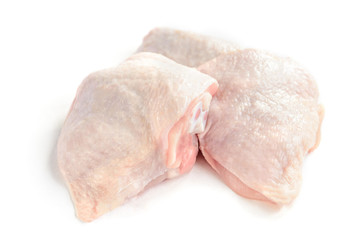 Wall Mural - Raw chicken thighs isolated on white background.