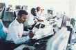 © Yakobchuk Olena - Group of workers sitting on dispatch board