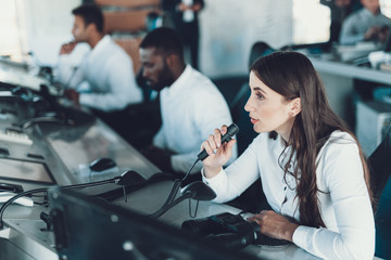 Young brunette woman working on dispatch board