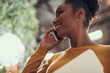© Yakobchuk Olena - Charming afro american girl talking on cellphone