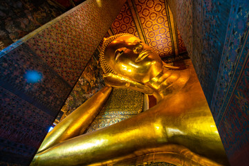 Gold statue reclining buddha indoor of Wat Pho buddhist temple