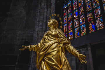 Wall Mural - Milan, Italy - AUGUSTA 18, 2018: Interior of Milan Cathedral Duomo. Statue of golden Madonna