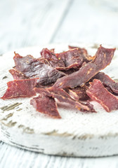 Poster - Beef jerky on the white wooden board