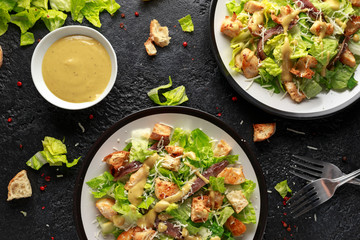 Wall Mural - Caesar salad with chicken, anchous fish, croutons, parmesan cheese and greens. healthy food