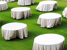 White Round Table On Green Filed