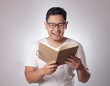 © airdone - Happy Man Smiling While Reading Book