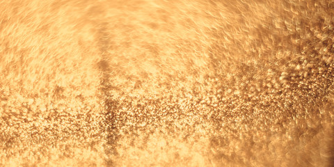Abstract shiny golden texture with bokeh blur.
