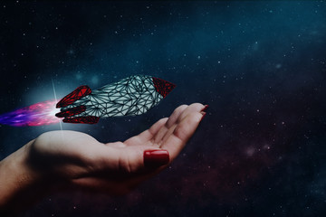 Leinwandbilder - Human hand holding Rocket. Nebula dust. Mixed media.