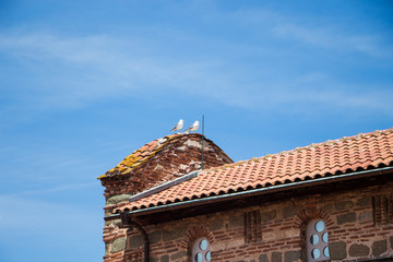 Wall Mural - Red Roof of an old building and blue sky. Nessebar. Bulgaria.