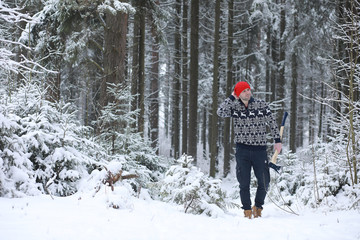 A man in the woods. Young man went to the logging.