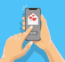 Sending Love Message Concept. Hand Holding Phone With Heart, Send Button On The Screen. Finger Touch Screen. Vector Flat Cartoon Illustration For Advertisement, Web Sites, Banners, Infographics Design