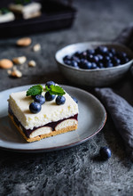 Cake With Layer Of Sponge Biscuits, Blueberry Jelly, And Whipped Cream