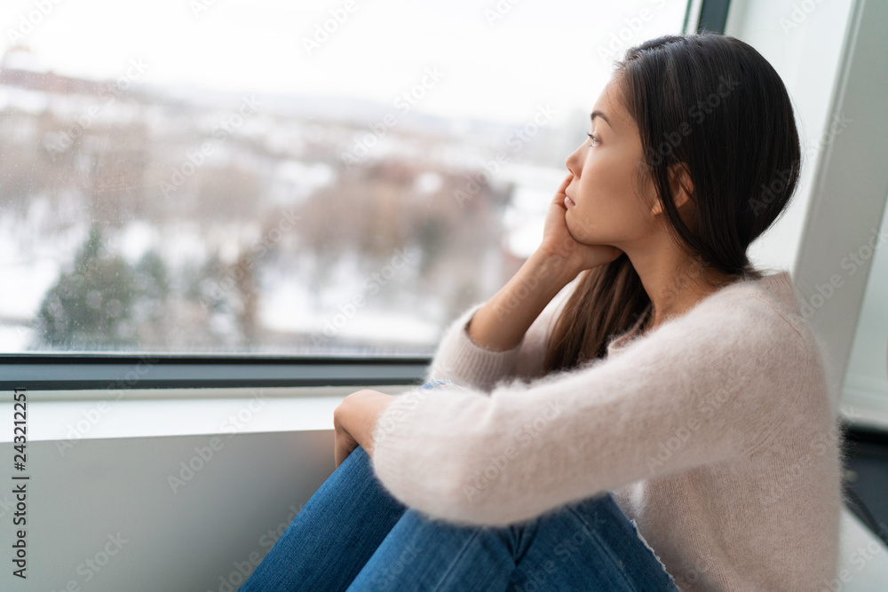 Winter seasonal affective disored SAD depression mood alone Asian girl feeling lonely - stress, anxiety, melancholy emotions. Sadness at home. - obrazy, fototapety, plakaty 