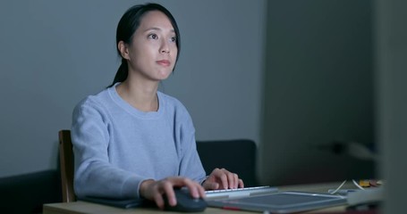 Wall Mural - Woman use of computer at night