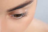 Fototapeta Panele - Young woman with beautiful natural eyelashes, closeup view