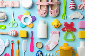 Wall Mural - flat lay composition with baby accessories and toys on color background