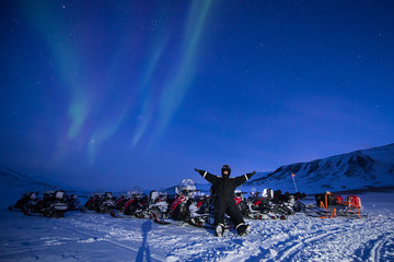 Wall Mural - the polar arctic northern lights aurora borealis sky star in norway svalbard in longyearbyen the sno