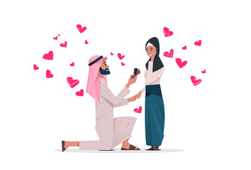 Wall Mural - Arab man kneeling holding engagement ring proposing