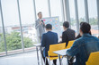 © saksit - Businessman presentation in a conference meeting room