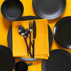 Poster - Set of black tableware on yellow