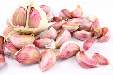 Wall Mural - garlic cloves  on a white background