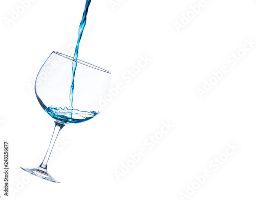 Fotografie, Obraz liquid splashing into a cocktail glass on a white background