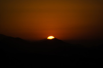 Wall Mural - Sunset in mountains