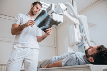 Wall Mural - Doctor Examining X-ray Films