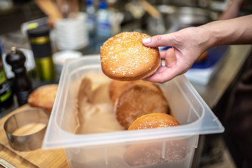 Sticker - Hand hold a cheeseburger bun