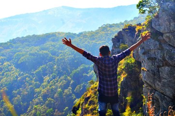 man on top of mountain