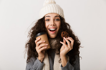 Poster - Cheerful young woman wearing winter scarf standing