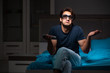 © Elnur - Man watching tv at night in bed