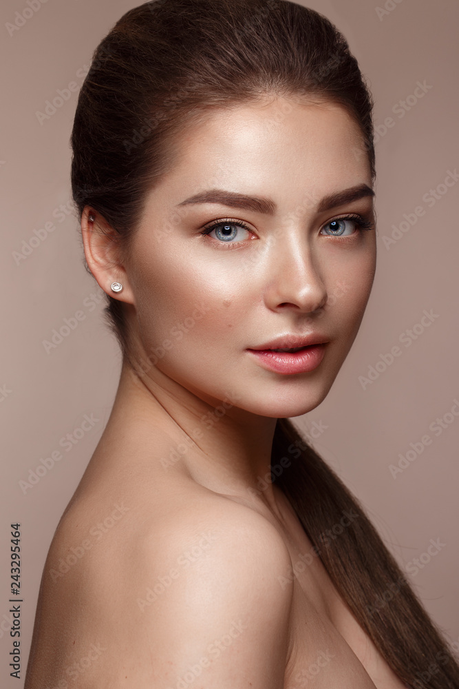Beautiful young girl with natural nude make-up. Beauty face. Stock