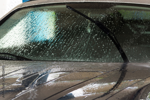 Fototapeta na szkło Car washing with high water pressure cleaning