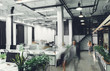 © LIGHTFIELD STUDIOS - modern office interior with blurred business people in motion