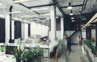 modern office interior with blurred business people in motion