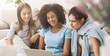 © Prostock-studio - Female roommates surfing internet on laptop at home