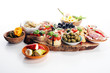 © beats_ - Italian antipasti wine snacks set. Cheese variety, Mediterranean olives, pickles, Prosciutto di Parma, tomatoes, artichokes