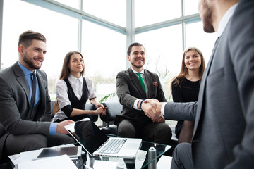 Business people shaking hands, finishing up a meeting. Handshake. Business concept.