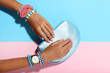 © 5second - Female hands with bracelets and handbag on colorful background
