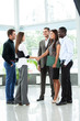 © opolja - Business people shaking hands, finishing up a meeting.