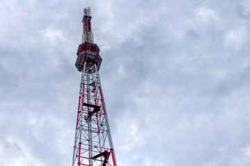 Big antenna on blue sky background.