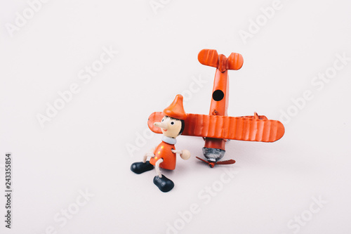 Airplane, Bullet and wooden pinocchio doll