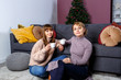 © Kanstantsinzzz - mother and daughter drink tea on Christmas Eve