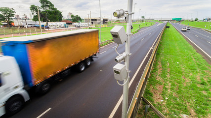 Traffic radar with speed enforcement camera in a highway.