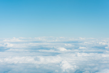 Wall Mural - Top of cloud overcast blue sky, above cloudy skyline.