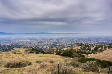 Hills and valleys in Alum Rock Park on a rainy day; San Jose, California in the background